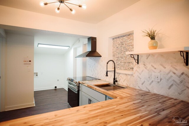 kitchen with sink, tasteful backsplash, stainless steel electric range oven, dark hardwood / wood-style flooring, and wall chimney range hood