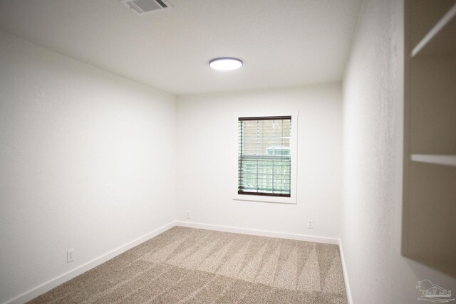 spare room with carpet floors