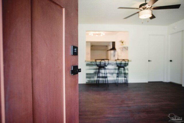 hallway featuring dark hardwood / wood-style floors