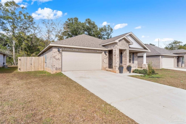 view of front of property featuring a garage and a front yard