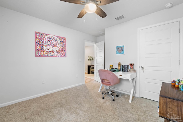 carpeted home office with ceiling fan