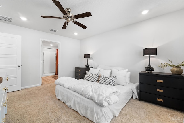 bedroom with light colored carpet and ceiling fan