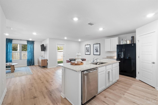 kitchen with black fridge with ice dispenser, white cabinetry, stainless steel dishwasher, and a center island with sink