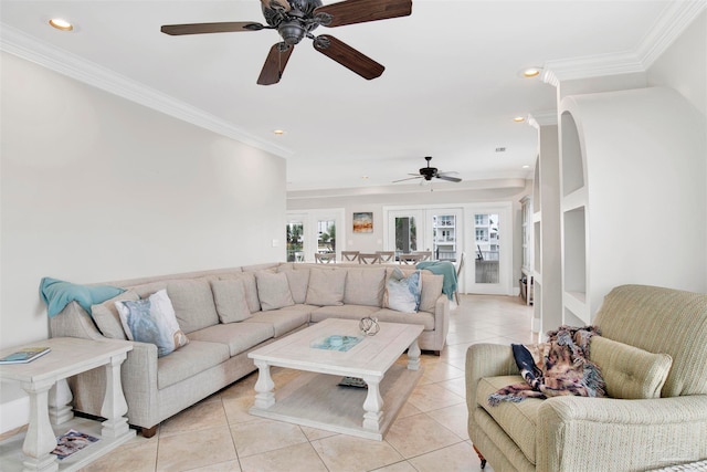 tiled living room with french doors, ceiling fan, and crown molding