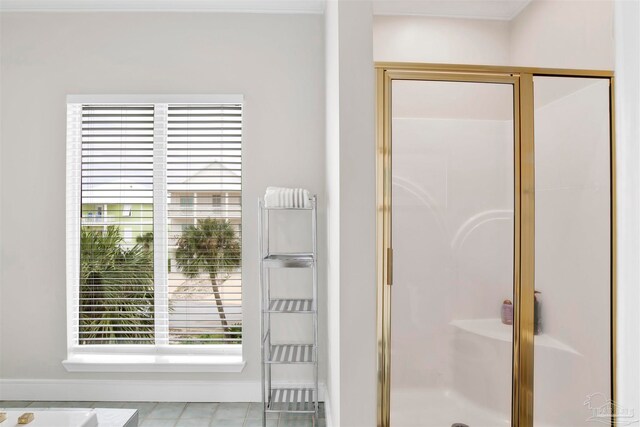 bathroom featuring a shower with door