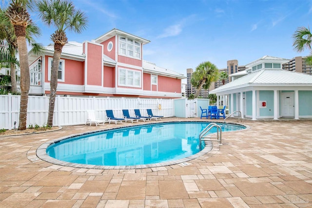 view of swimming pool with a patio area