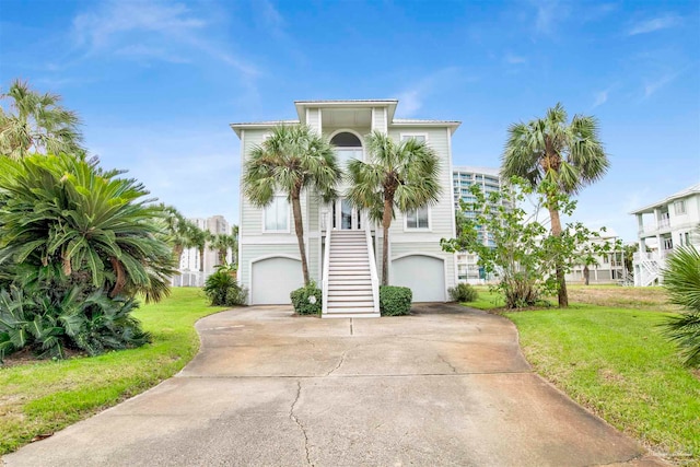 view of front facade with a front yard and a garage