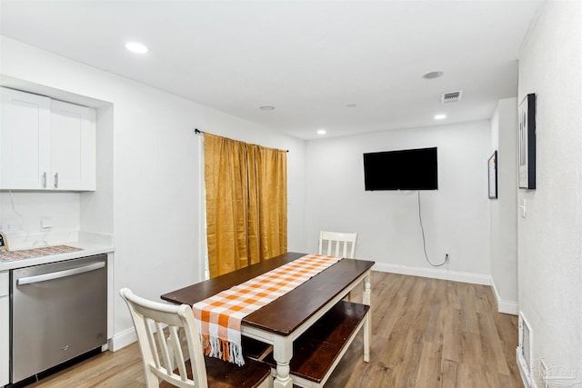 dining area with light hardwood / wood-style flooring