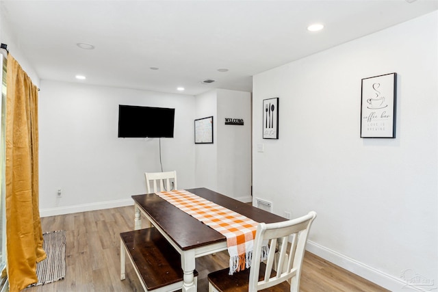 dining room with light hardwood / wood-style flooring