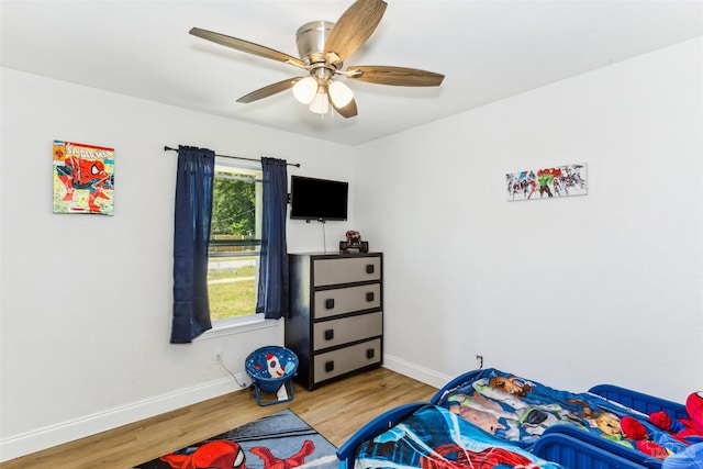 bedroom with wood-type flooring and ceiling fan