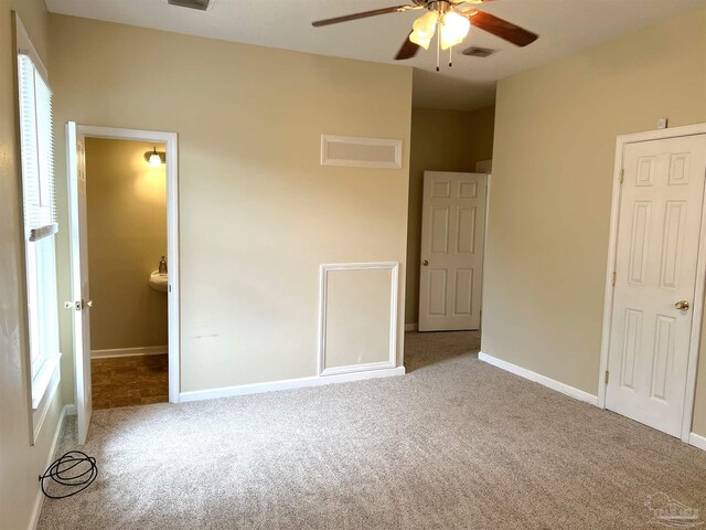 unfurnished bedroom featuring ceiling fan and light colored carpet