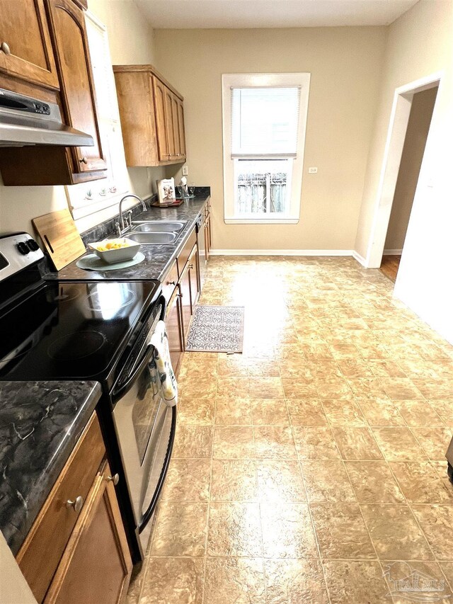 kitchen with range with electric stovetop and sink