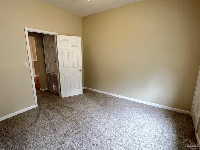 unfurnished bedroom featuring carpet flooring