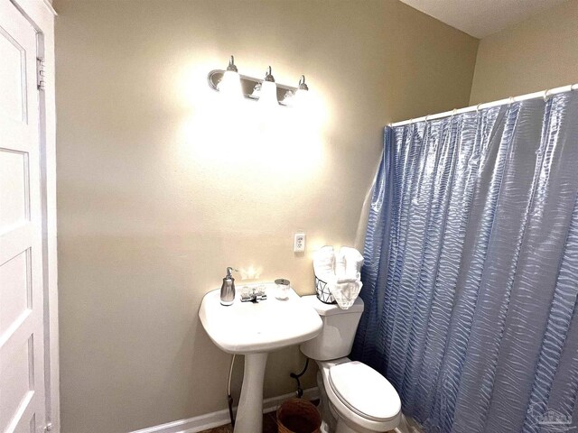 bathroom featuring toilet