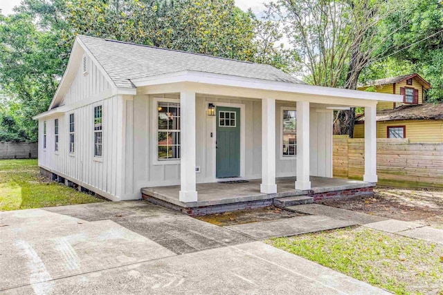 206 N G St, Pensacola, FL 32502 - view of outbuilding featuring covered porch and fence