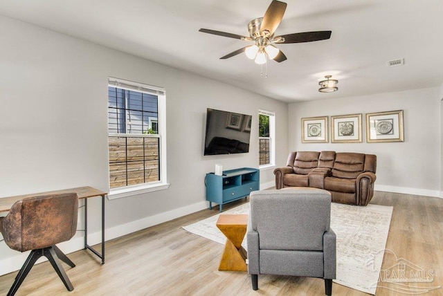 206 N G St, Pensacola, FL 32502 - living area with plenty of natural light, light wood-type flooring, ceiling fan, and baseboards