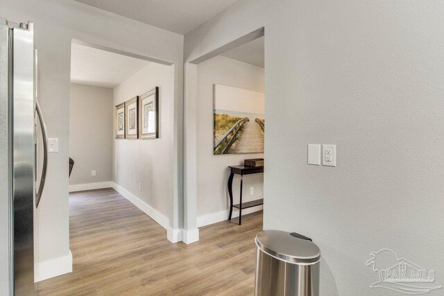 206 N G St, Pensacola, FL 32502 - corridor with light wood finished floors and baseboards