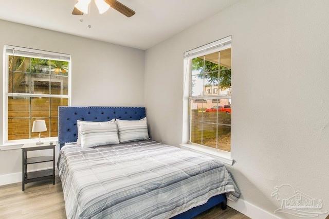 206 N G St, Pensacola, FL 32502 - bedroom featuring multiple windows, wood finished floors, baseboards, and ceiling fan