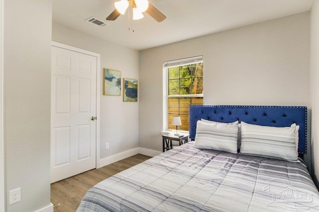 206 N G St, Pensacola, FL 32502 - bedroom with wood finished floors, baseboards, and a ceiling fan