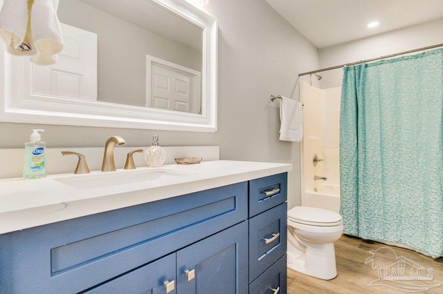 206 N G St, Pensacola, FL 32502 - full bath with vanity, wood finished floors, toilet, shower / bathtub combination with curtain, and recessed lighting