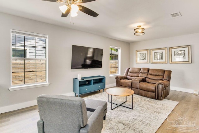 206 N G St, Pensacola, FL 32502 - living room with baseboards, a ceiling fan, and wood finished floors
