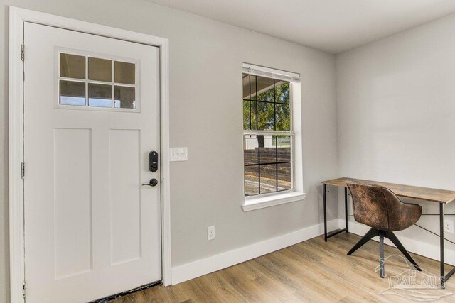 206 N G St, Pensacola, FL 32502 - doorway to outside with baseboards, wood finished floors, and a desk