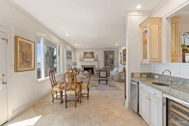 living room featuring a wealth of natural light, light tile patterned floors, and crown molding