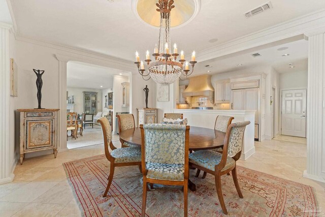 dining room with light tile patterned flooring, baseboards, visible vents, and ornamental molding