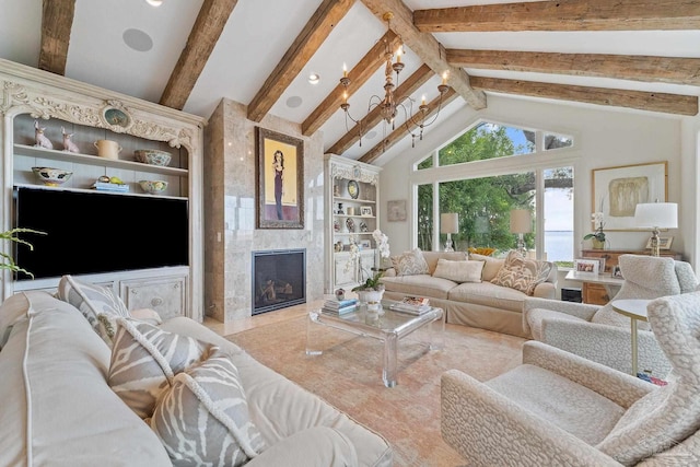 living room with high vaulted ceiling, built in features, beam ceiling, and a high end fireplace