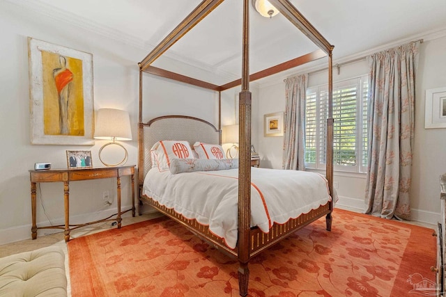 bedroom with ornamental molding and baseboards