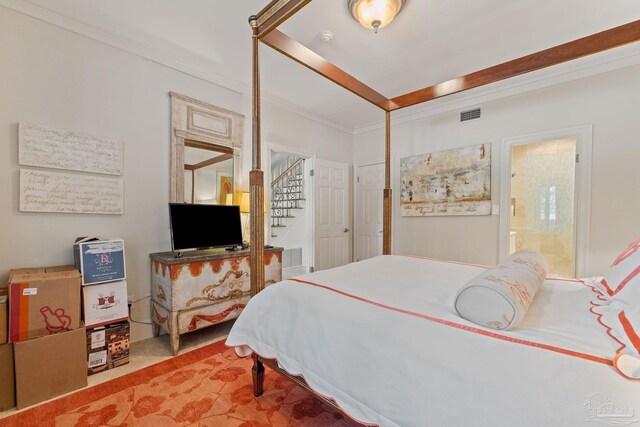 bathroom with toilet, tile patterned floors, and crown molding