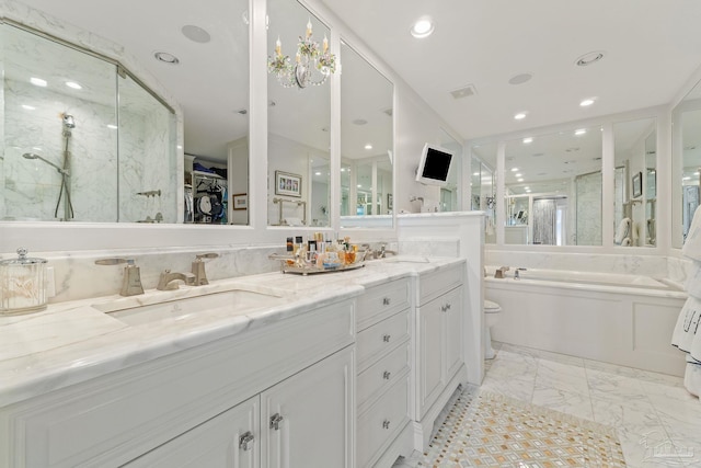 full bath with double vanity, a shower stall, a spacious closet, and a sink