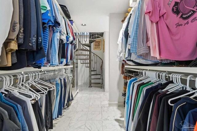 spacious closet featuring marble finish floor