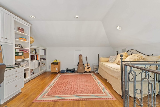 bedroom featuring recessed lighting, visible vents, vaulted ceiling, and light wood finished floors