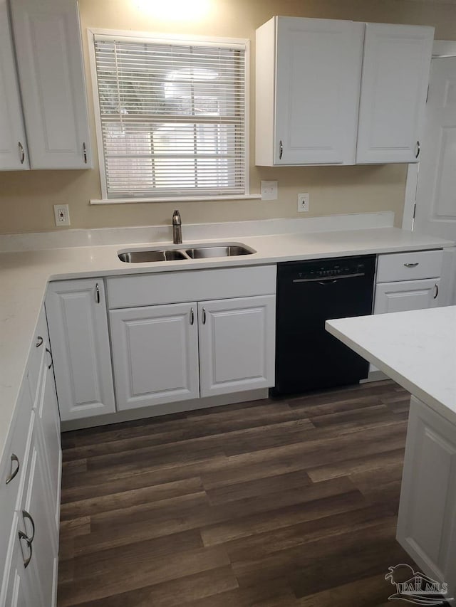 kitchen featuring a sink, black dishwasher, and white cabinetry