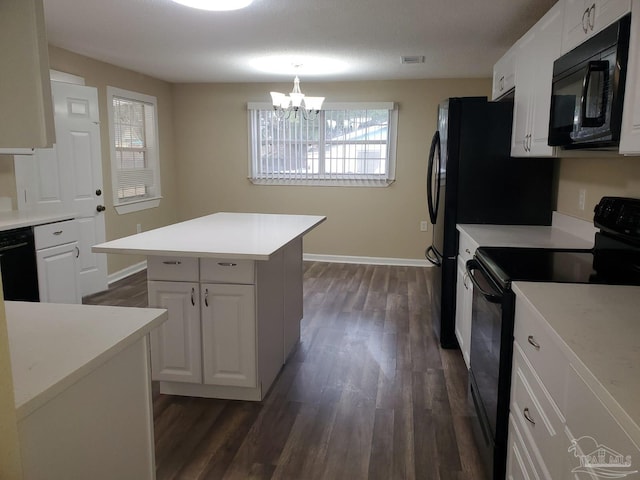 kitchen with visible vents, dark wood-type flooring, black appliances, and white cabinets