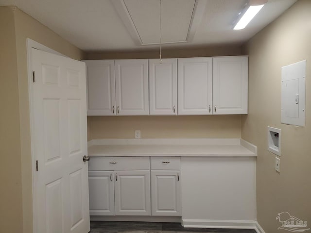 laundry room with electric panel, cabinet space, washer hookup, and attic access