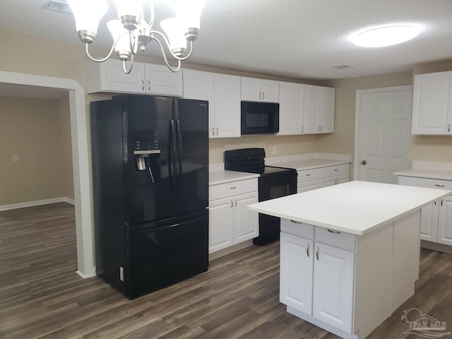 kitchen featuring dark wood-style floors, black appliances, white cabinets, light countertops, and a center island