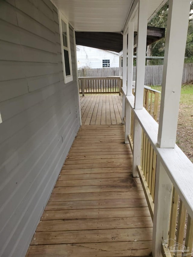 wooden deck with fence and covered porch