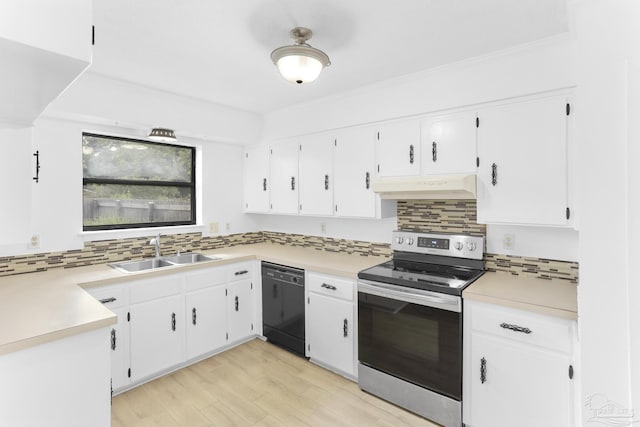 kitchen featuring stainless steel electric stove, black dishwasher, sink, white cabinets, and backsplash