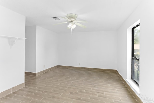 unfurnished room with ceiling fan