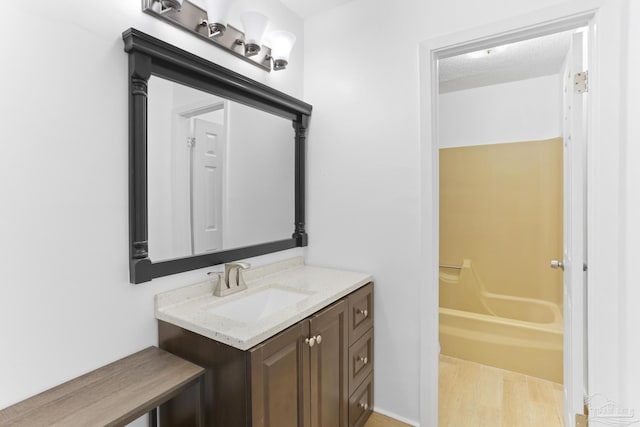 bathroom featuring vanity and a textured ceiling