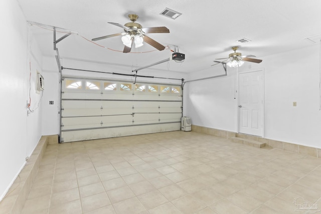 garage featuring a garage door opener and ceiling fan