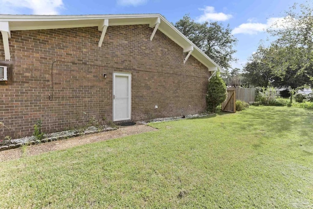 view of side of property featuring a yard