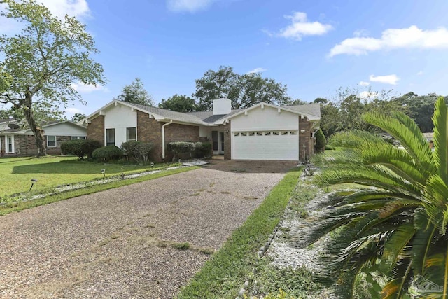 ranch-style house featuring a garage and a front lawn