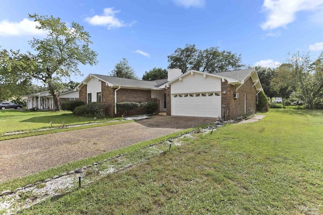 single story home featuring a garage and a front yard