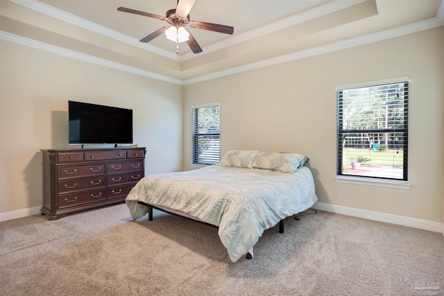 bedroom featuring multiple windows, ornamental molding, light carpet, and ceiling fan