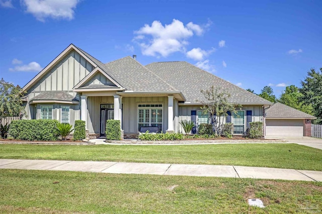 view of front of house featuring a garage and a front lawn