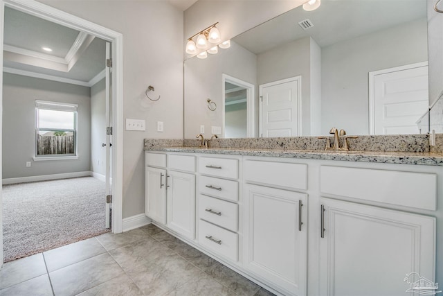 bathroom featuring vanity, tile patterned flooring, ornamental molding, and a raised ceiling