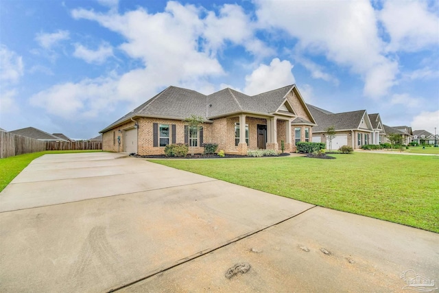 craftsman-style house featuring a garage and a front yard